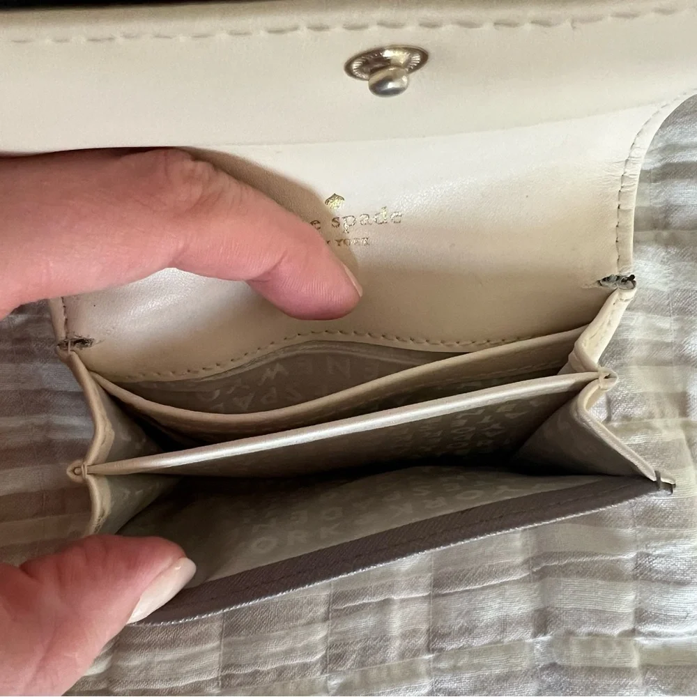 kate spade taupe leather compact wallet with gold logo